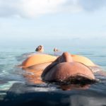 woman floating in sea water